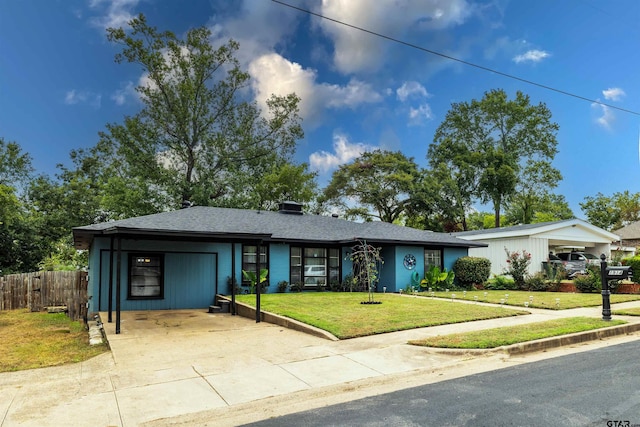 ranch-style house with a front yard and a carport