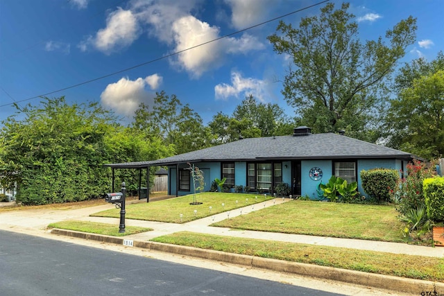 single story home with a front lawn and a carport