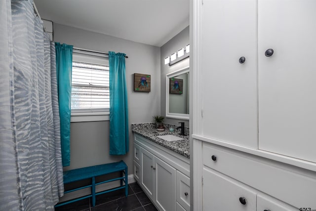 bathroom featuring tile patterned flooring and vanity