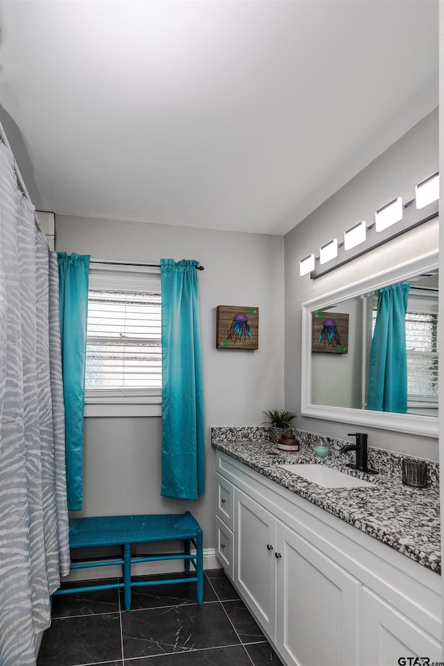 bathroom with vanity and tile patterned floors