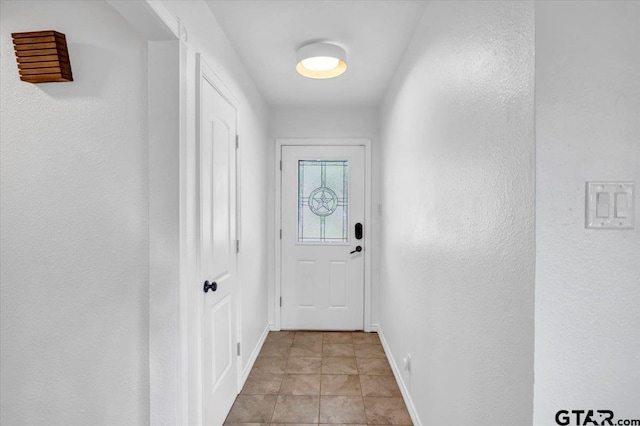 415 Lonestar Ln, Hideaway, TX 75771 - doorway with baseboards and a textured wall