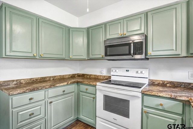 415 Lonestar Ln, Hideaway, TX 75771 - kitchen featuring stainless steel microwave, white electric range oven, green cabinetry, and dark countertops
