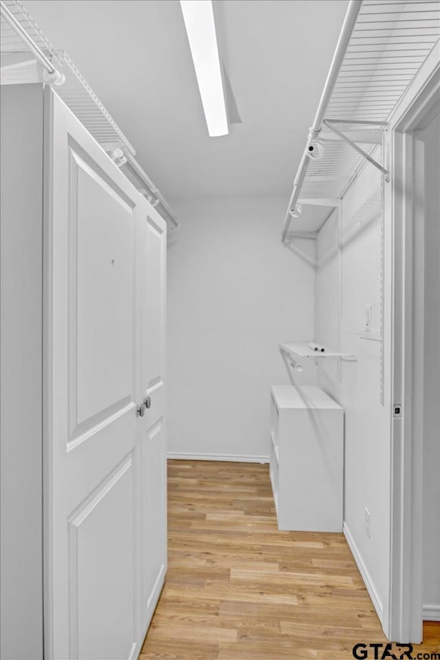 415 Lonestar Ln, Hideaway, TX 75771 - walk in closet featuring light wood finished floors