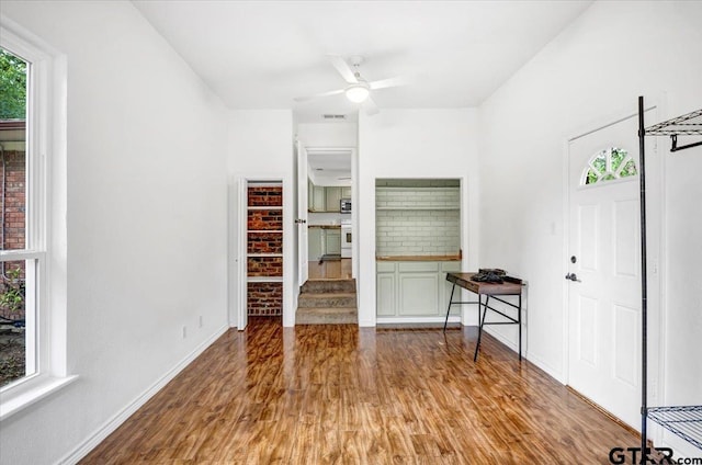 415 Lonestar Ln, Hideaway, TX 75771 - unfurnished bedroom with wood finished floors, baseboards, and ceiling fan