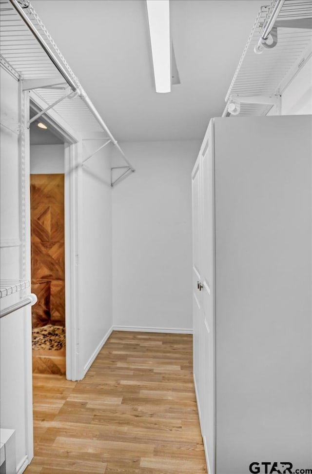 415 Lonestar Ln, Hideaway, TX 75771 - walk in closet featuring light wood finished floors