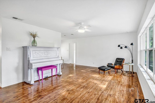 415 Lonestar Ln, Hideaway, TX 75771 - living area with wood finished floors, baseboards, and ceiling fan