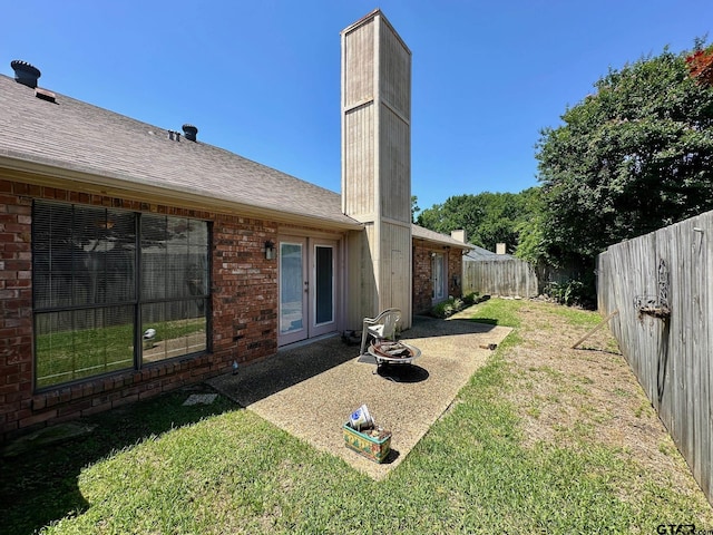 415 Amberwood Cir, Tyler, TX 75701 - view of yard with french doors and a patio