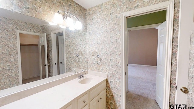 415 Amberwood Cir, Tyler, TX 75701 - bathroom with vanity and baseboards