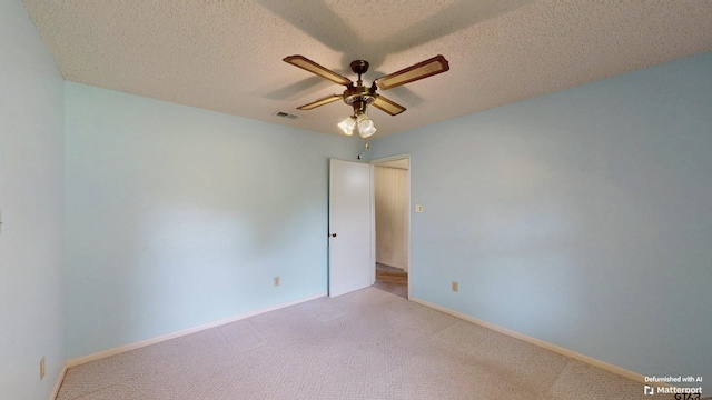 218 Lilly Ln, Bullard, TX 75757 - unfurnished room with ceiling fan, light carpet, baseboards, and a textured ceiling