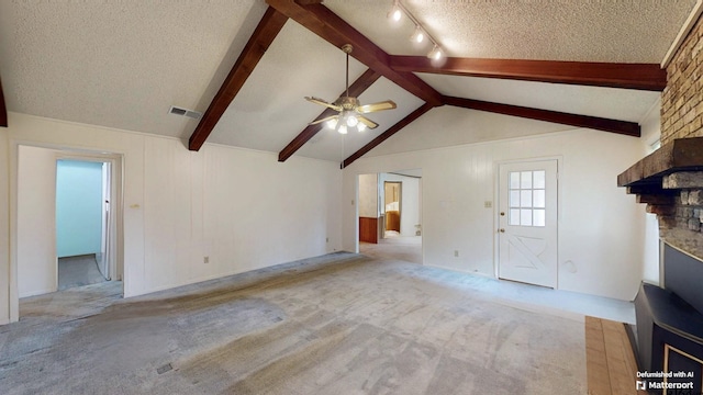 218 Lilly Ln, Bullard, TX 75757 - unfurnished living room with a large fireplace, carpet, ceiling fan, and a textured ceiling