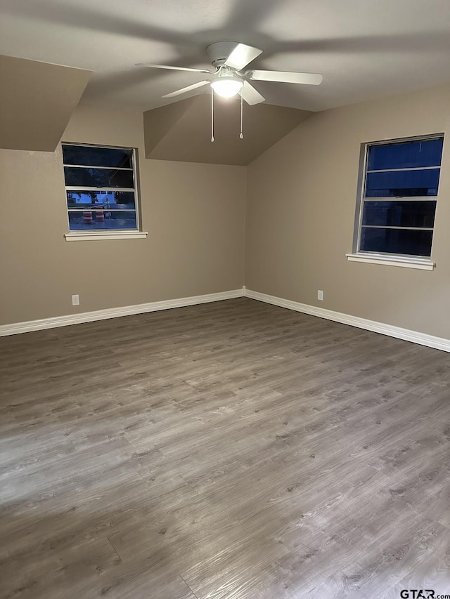 bonus room with wood-type flooring, vaulted ceiling, and ceiling fan