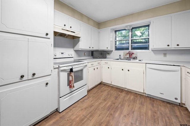 kitchen with dark hardwood / wood-style floors, white cabinetry, white appliances, and sink