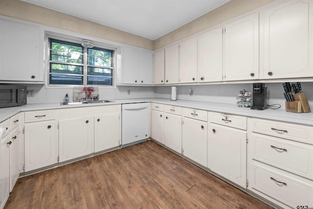 kitchen with white cabinetry, dishwasher, dark hardwood / wood-style floors, and sink