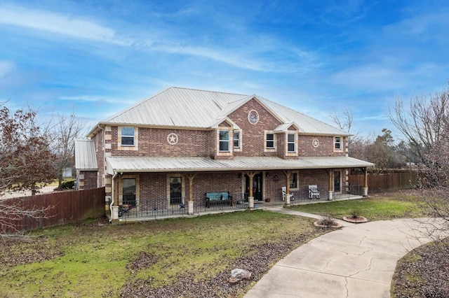 view of front of property with a front lawn and a porch