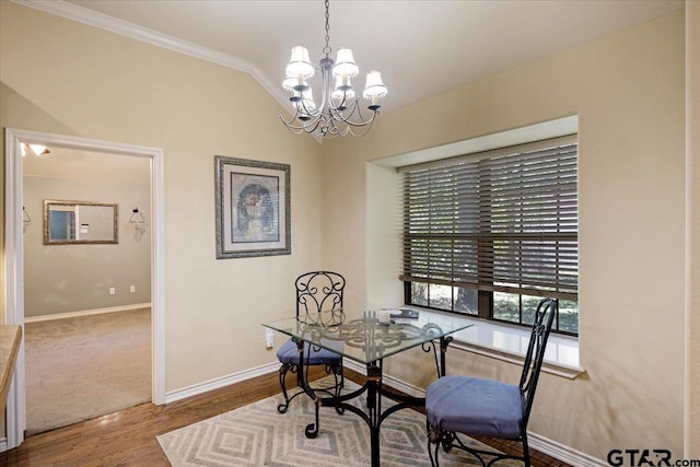5609 Andover Dr, Tyler, TX 75707 - dining area with an inviting chandelier, baseboards, crown molding, and wood finished floors
