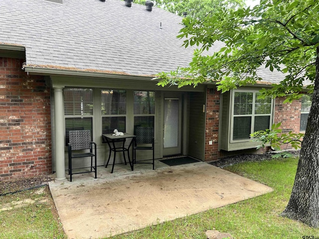 5609 Andover Dr, Tyler, TX 75707 - exterior space with brick siding, a patio area, and roof with shingles