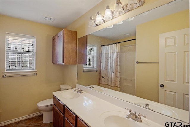 5609 Andover Dr, Tyler, TX 75707 - full bath with a sink, a shower with shower curtain, and toilet