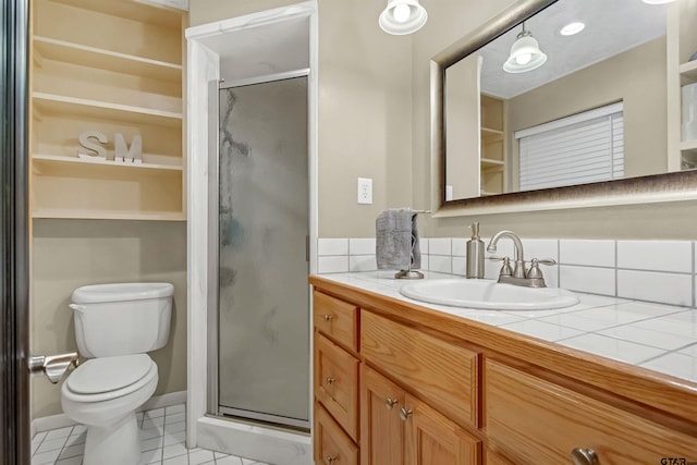 bathroom with backsplash, a shower with shower door, vanity, and tile patterned flooring