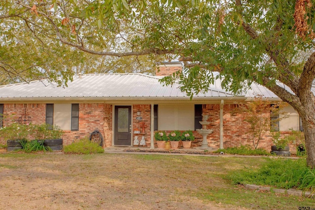 ranch-style home featuring a front yard