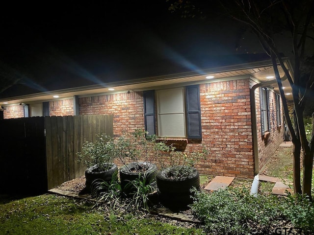 view of property exterior at night