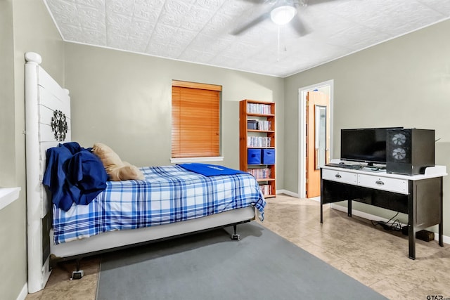 bedroom featuring light tile patterned floors and ceiling fan