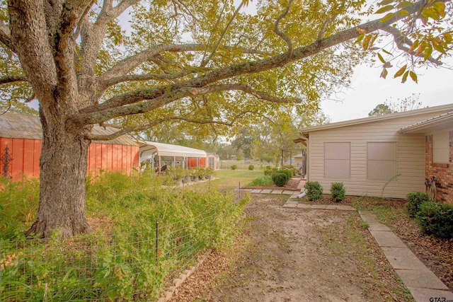 view of yard with a carport