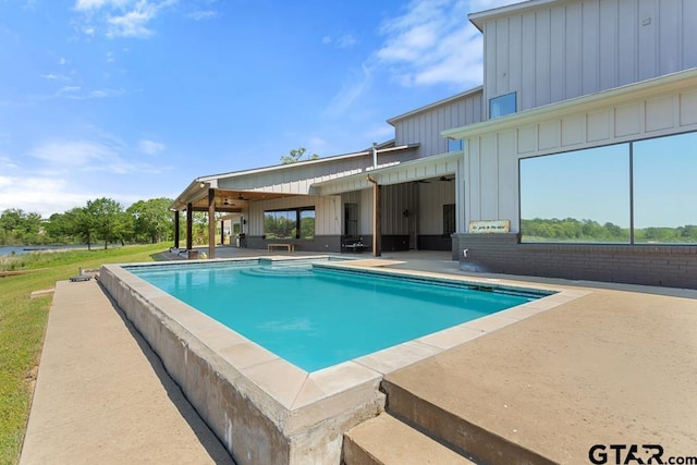 pool featuring a patio area and a ceiling fan