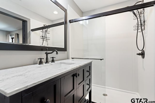 full bathroom featuring vanity and a shower