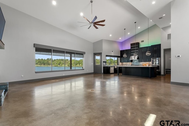 unfurnished living room featuring high vaulted ceiling, concrete flooring, ceiling fan, baseboards, and visible vents
