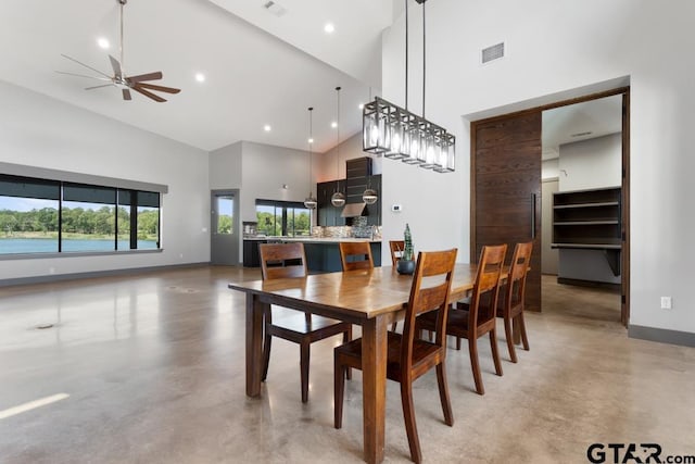 dining space with high vaulted ceiling, baseboards, a ceiling fan, and finished concrete flooring