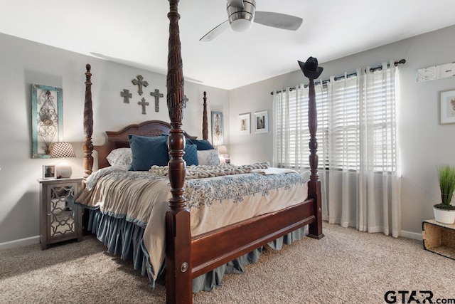 carpeted bedroom with a ceiling fan and baseboards