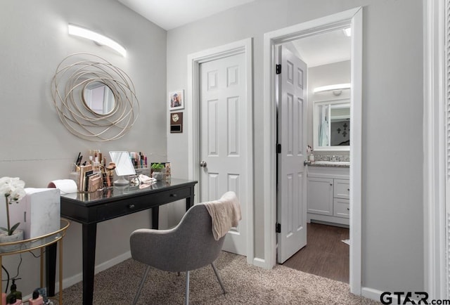 home office featuring dark colored carpet