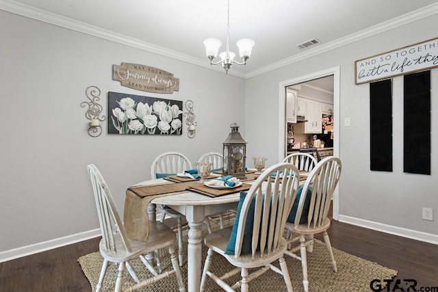 dining area featuring baseboards, visible vents, dark wood finished floors, and ornamental molding