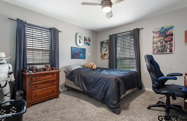 bedroom featuring baseboards, a ceiling fan, and carpet flooring