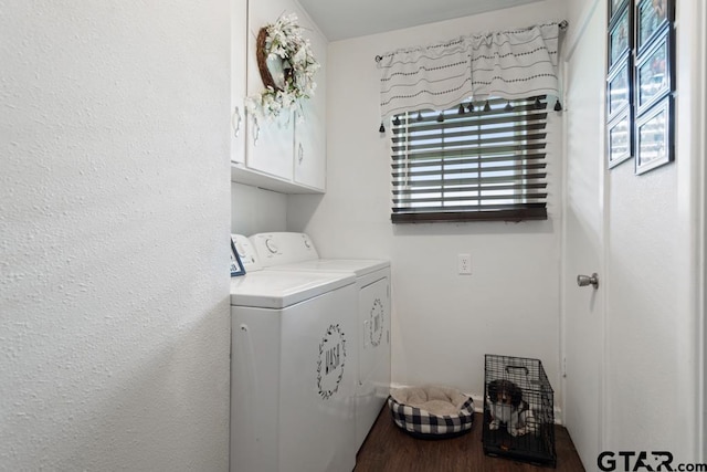 laundry area with independent washer and dryer, wood finished floors, and cabinet space