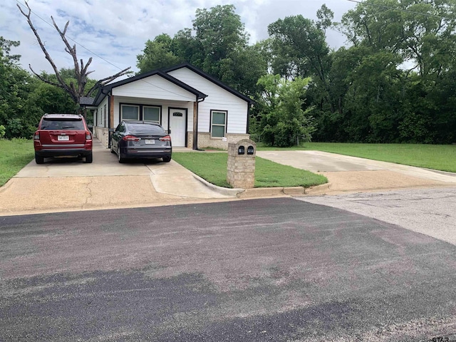 501 W Vance St, Tyler, TX 75702 - view of front of home featuring a front yard, concrete driveway, and brick siding