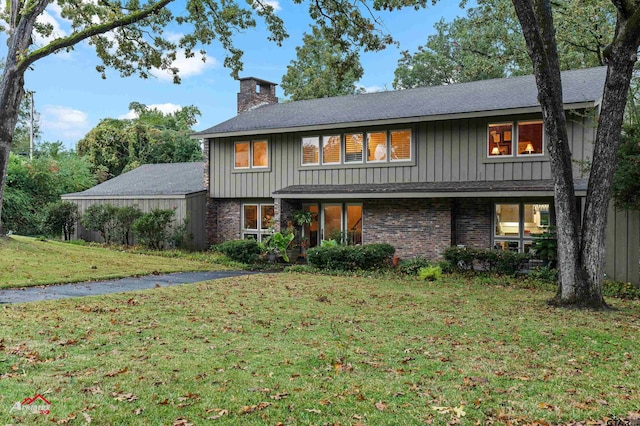 view of front of home with a front yard