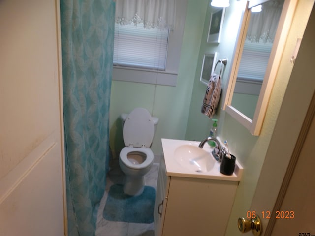 bathroom featuring vanity and toilet