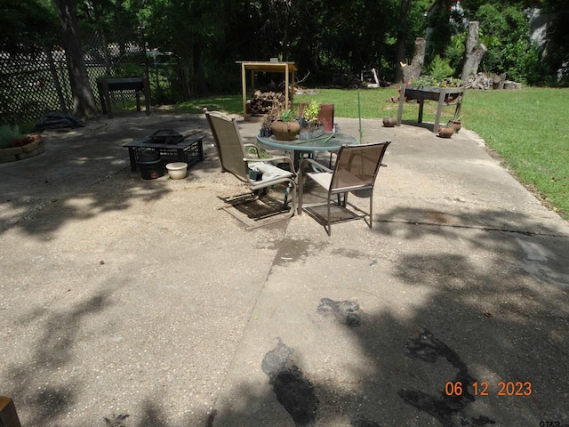 view of patio / terrace featuring an outdoor fire pit