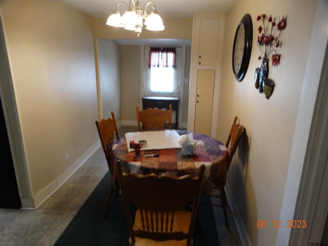 dining area featuring a notable chandelier