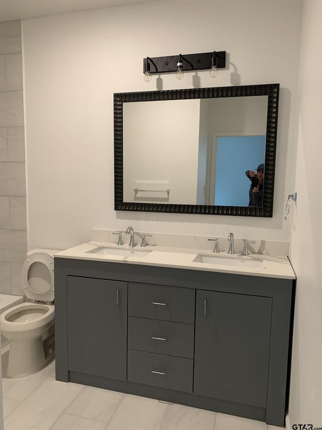 bathroom with vanity and toilet