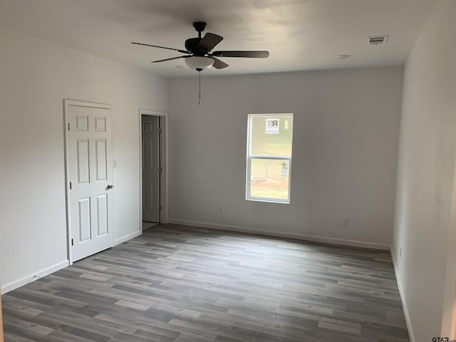 spare room featuring ceiling fan and wood-type flooring