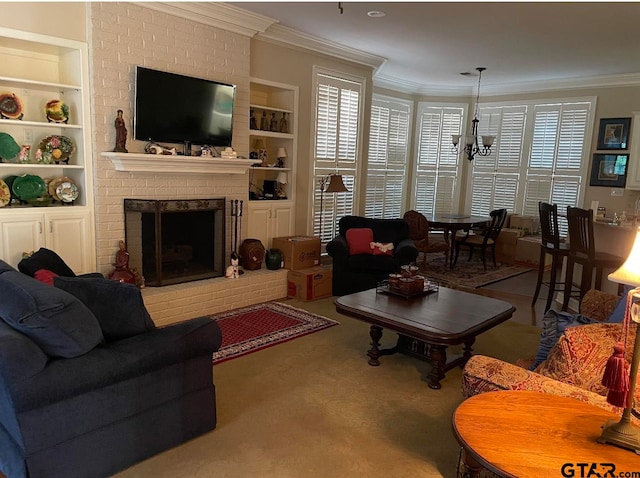 carpeted living room with built in shelves, ornamental molding, a fireplace, and a chandelier