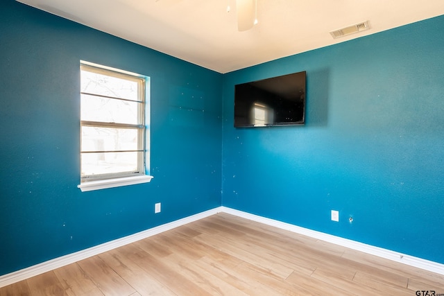 unfurnished room with ceiling fan and light hardwood / wood-style flooring