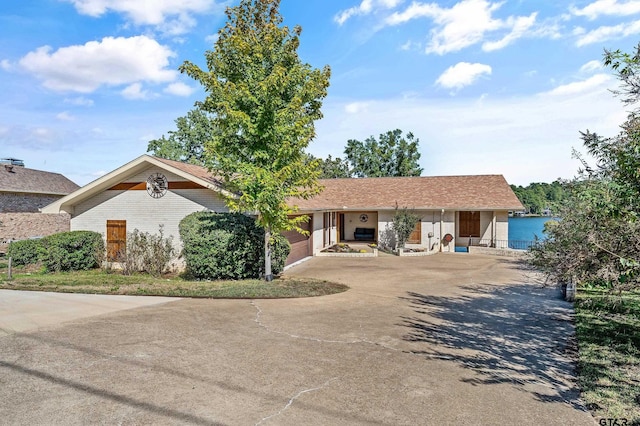 ranch-style house featuring a garage