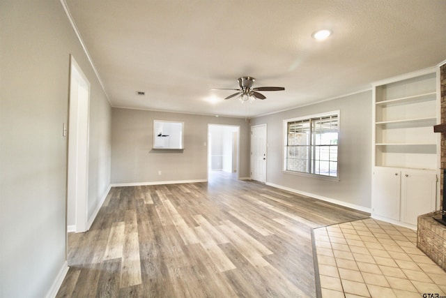 unfurnished living room featuring crown molding, light hardwood / wood-style flooring, and ceiling fan