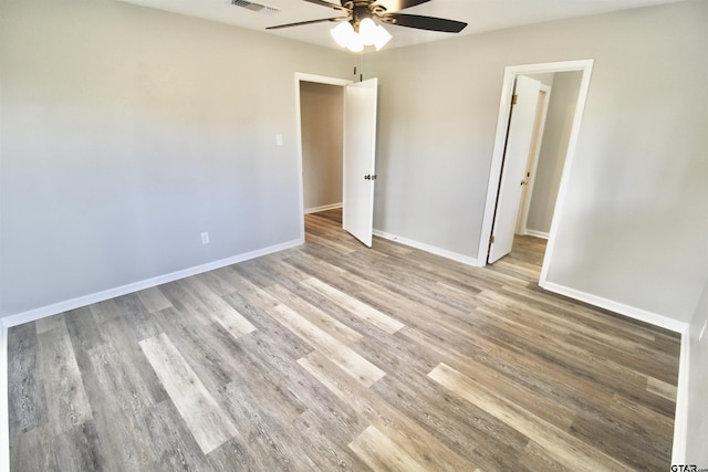 unfurnished bedroom featuring ceiling fan and light hardwood / wood-style floors