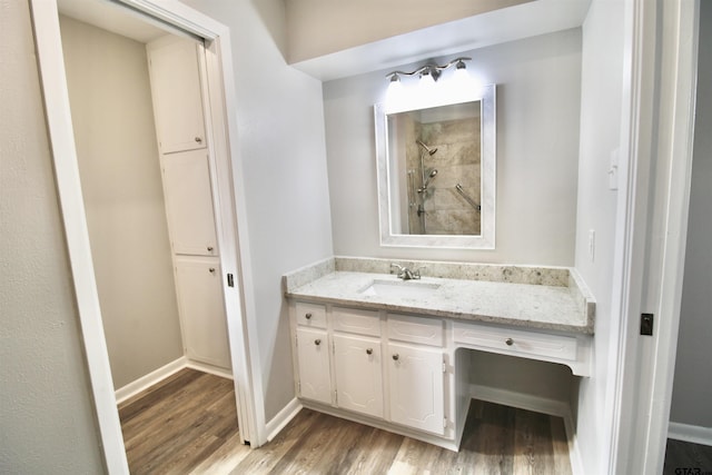 bathroom featuring hardwood / wood-style floors and vanity