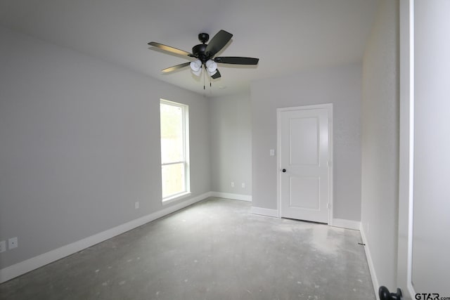 unfurnished room with ceiling fan