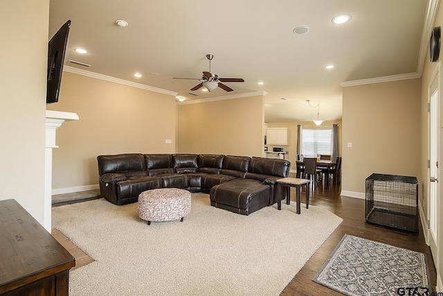 10821 Cactus Trl, Flint, TX 75762 - living room with ceiling fan, ornamental molding, recessed lighting, and dark wood-style flooring